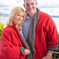 Couple wearing red and tan fleece jacket