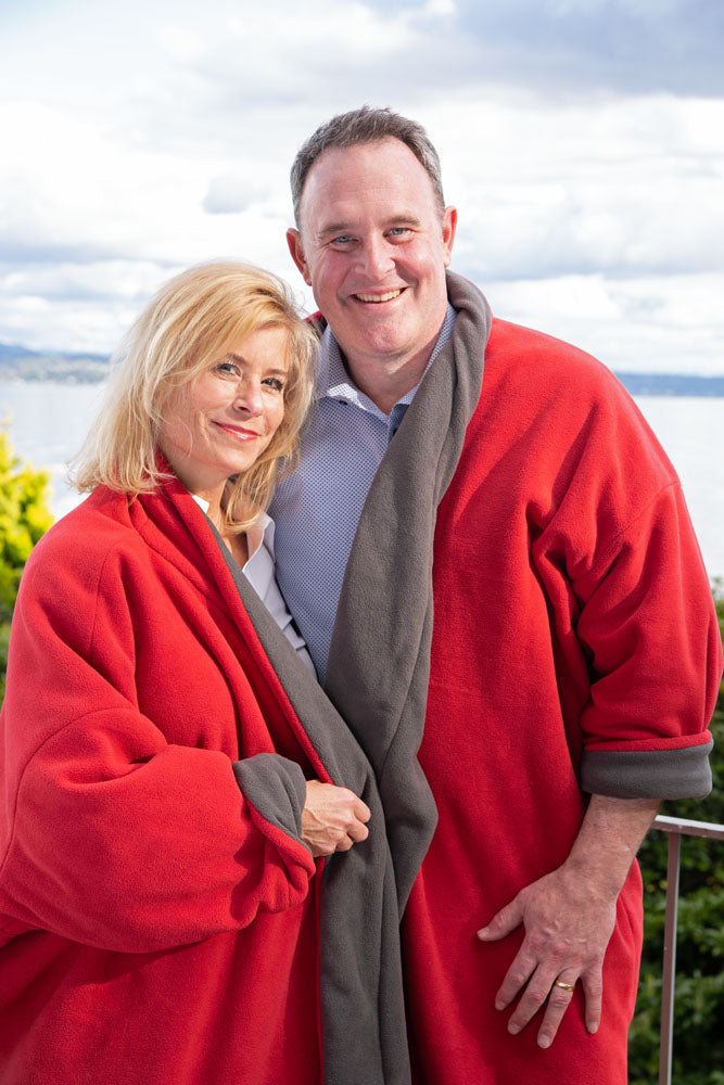 Couple wearing red and tan fleece jacket