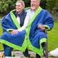 Seated couple wearing blue and green fleece jacket