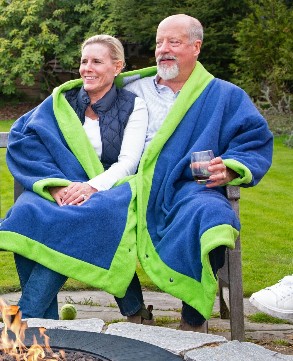 Seated couple wearing blue and green fleece jacket